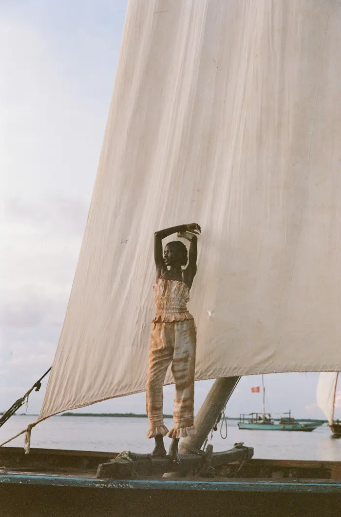 Arms up on boat