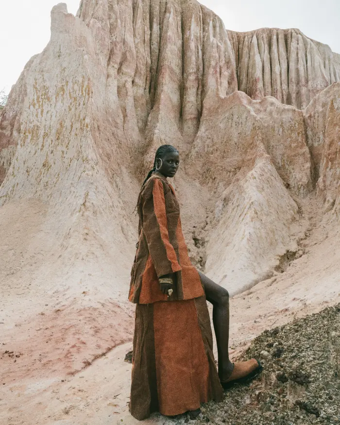 Brown outfit standing on rocks