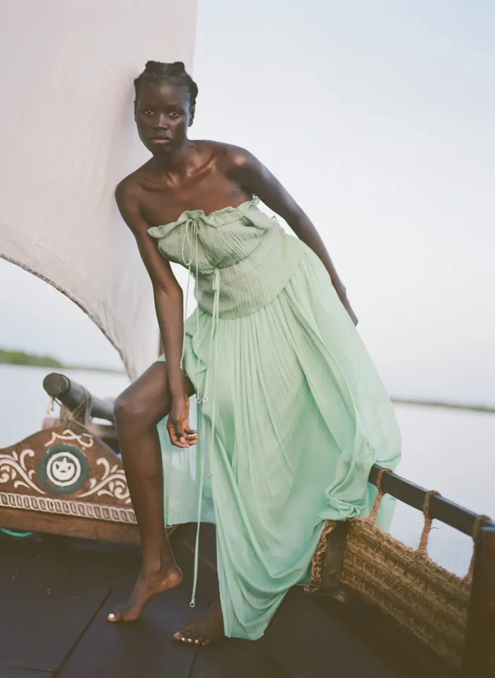 Green dress on boat