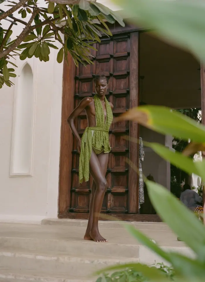 Green dress in doorway