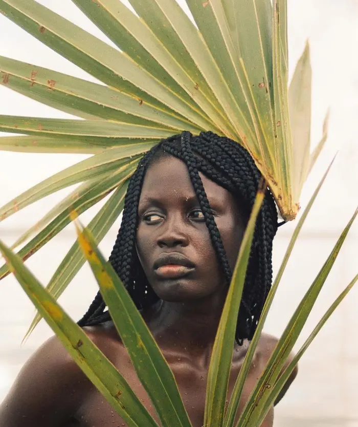 Portrait with palm leaves